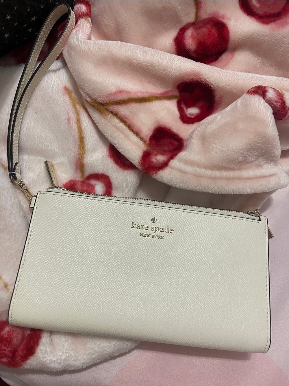 kate spade cream leather wristlet clutch with gold logo